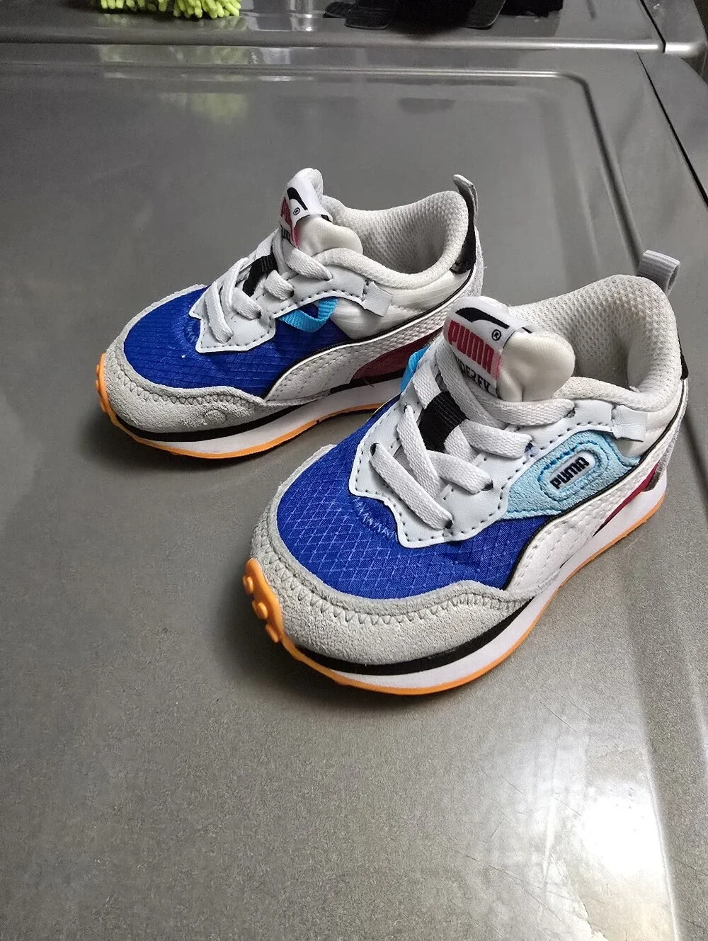 Puma Kids Royal Blue, White & Light Blue Sneakers with Orange Accent